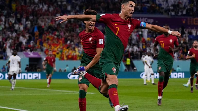 Portugal's Cristiano Ronaldo celebrates after scoring from the penalty spot...