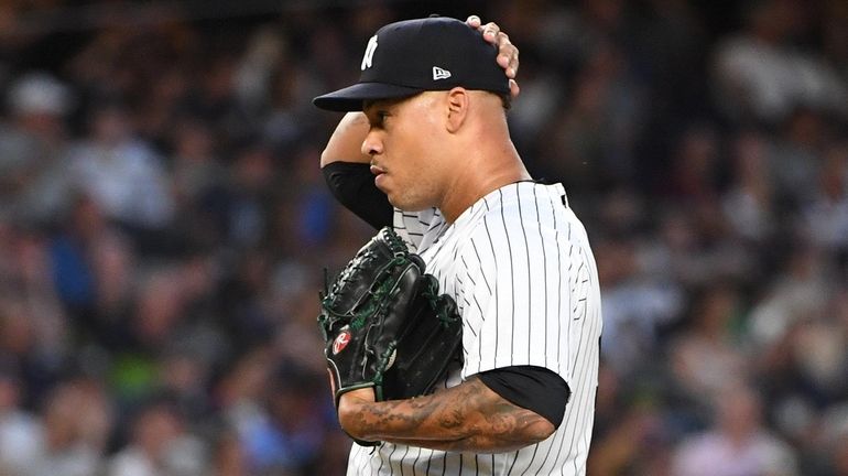 Yankees starting pitcher Frankie Montas stands on the mound after...