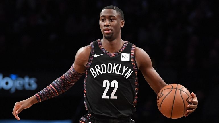 Brooklyn Nets guard Caris LeVert dribbles the ball up court...