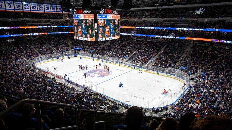 Islanders fans watch the second period of action at the...