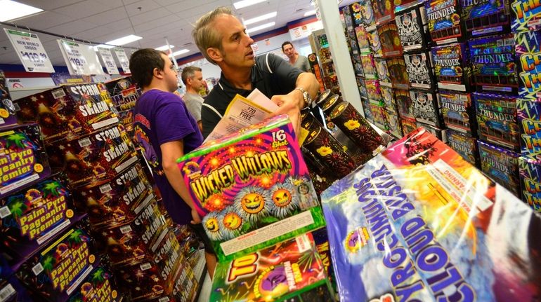 Craig Allen of New York fills up his shopping cart with fireworks...