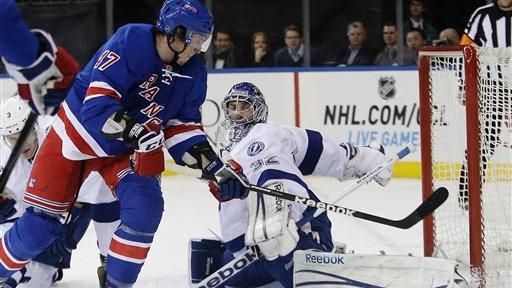 Tampa Bay Lightning goalie Mathieu Garon (32) blocks a shot...