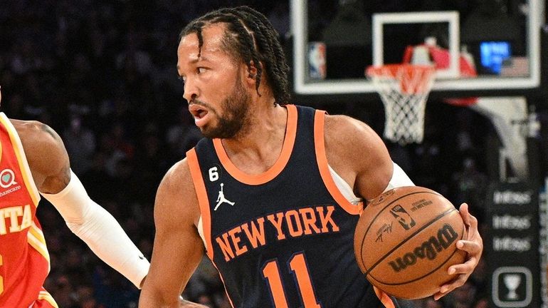 Knicks guard Jalen Brunson controls the ball ahead of Atlanta...