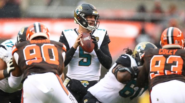 Blake Bortles of the Jacksonville Jaguars looks to throw a...