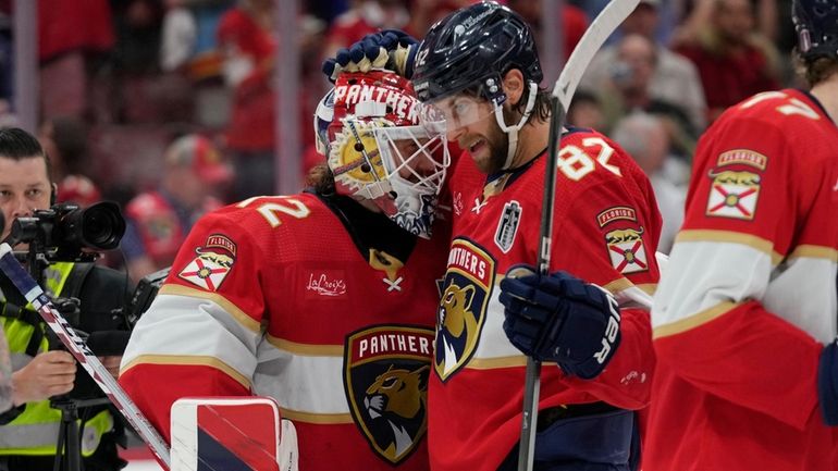 Florida Panthers goaltender Sergei Bobrovsky (72) and center Kevin Stenlund...