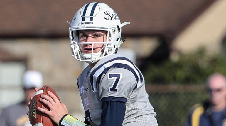 Oceanside quarterback Charlie McKee looks to execute a screen pass...