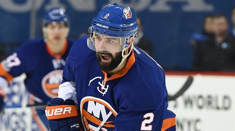 New York Islanders defenseman Nick Leddy controls the puck against...