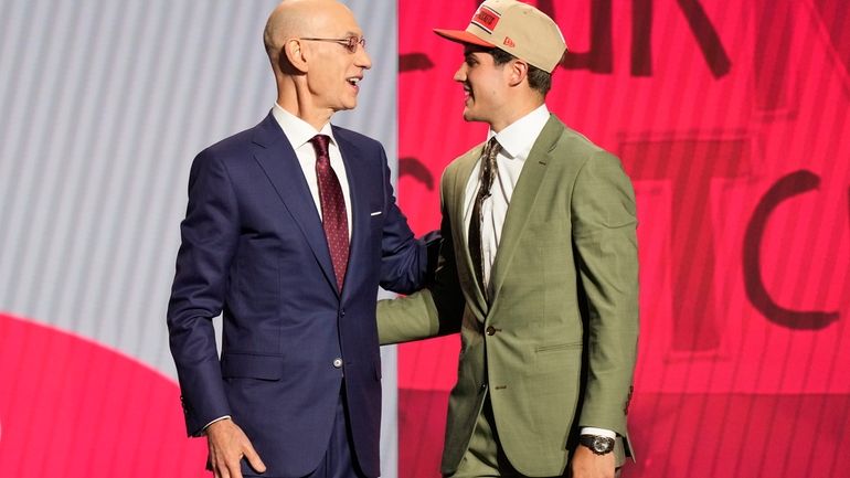 Reed Sheppard, right, greets NBA commissioner Adam Silver after being...