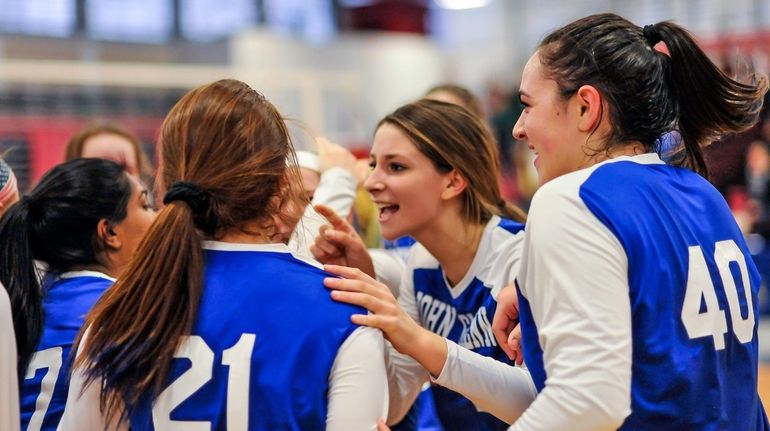 Glenn's Mia Cergol, center, leads the team's celebration after beating...