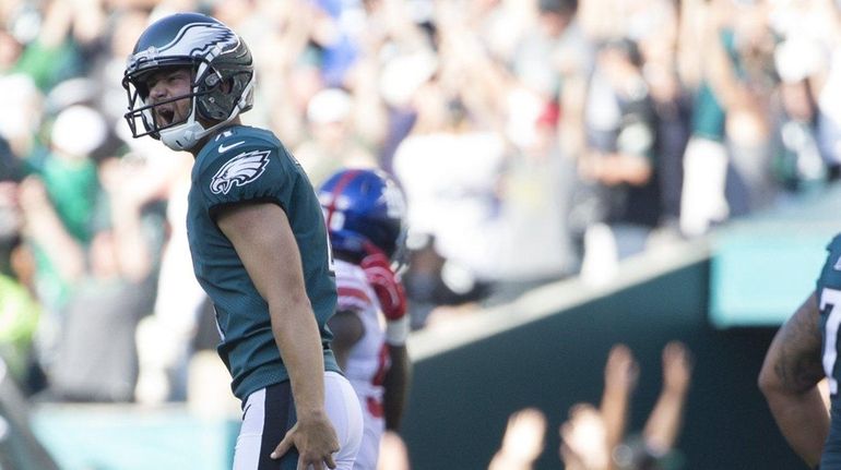 Eagles kicker Jake Elliott celebrates in front of Giants defensive...