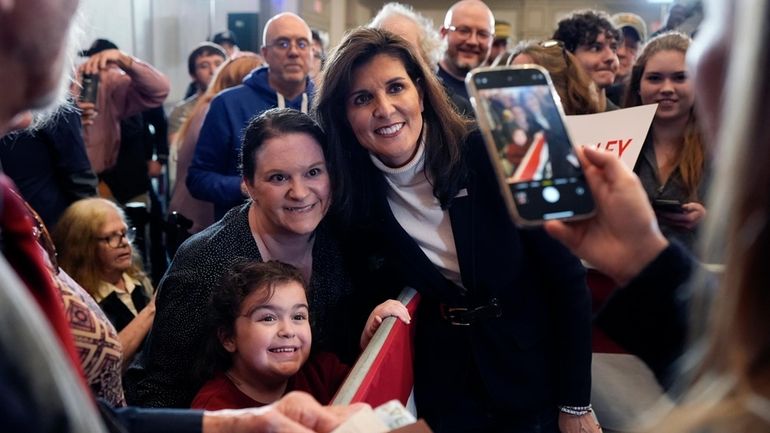 Republican presidential candidate former UN Ambassador Nikki Haley poses for...