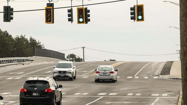 Vehicles move on the newly constructed Hospital Road Bridge in East...