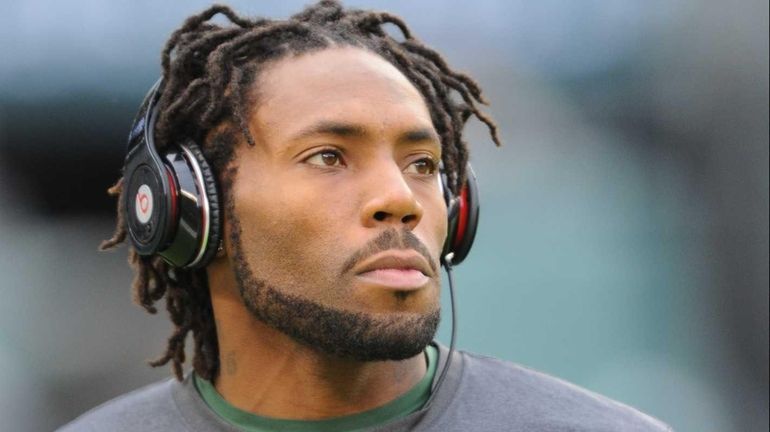 Jets cornerback Antonio Cromartie warms up before the game against...