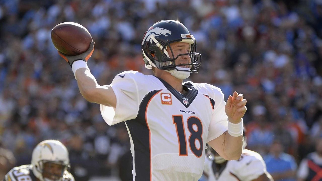 Denver Broncos Peyton Manning throws against the New England Patriots  during the AFC Championship game at Sport Authority Field at Mile High in  Denver on January 24, 2016. Denver advances to Super