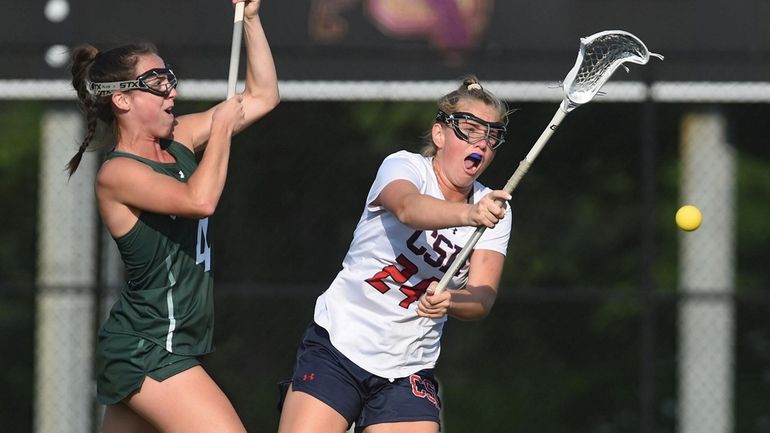 Amelia Bentley #24 of Cold Spring Harbor, right, scores a...