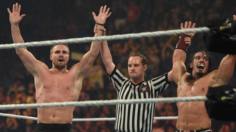 Stephen Amell and Neville are declared the winners against Stardust...