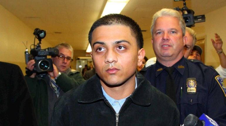 Joseph Beer is brought into the Nassau County Courthouse in...