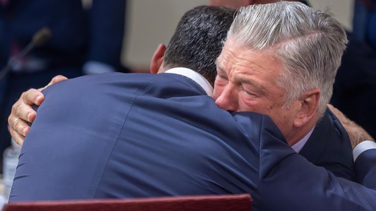 Actor Alec Baldwin, right, hugs his defense attorney Alex Spiro...