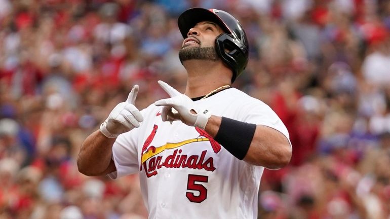 St. Louis Cardinals' Albert Pujols celebrates after hitting a two-run...