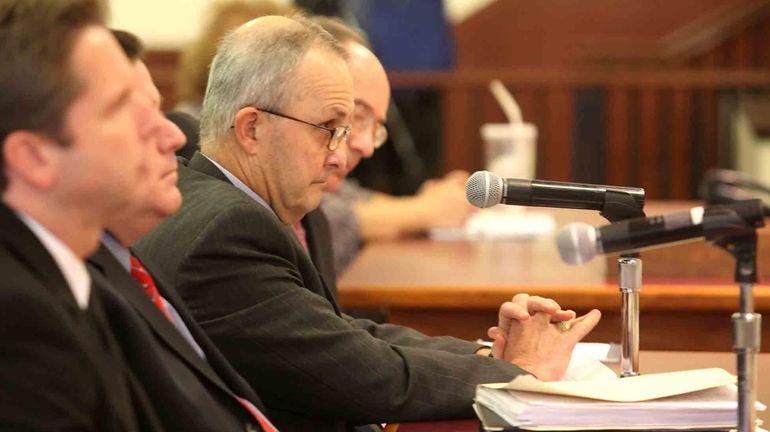 Nassau Police Commissioner Lawrence Mulvey is questioned by the legislature...