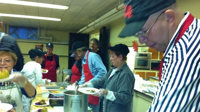 Volunteers at the Congregational Church of Patchogue, including Village Mayor...