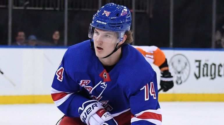 Rangers right wing Vitali Kravtsov skates with the puck against...