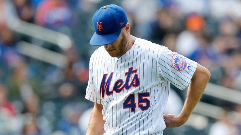 Zack Wheeler, No. 45, of the Mets leaves a game...