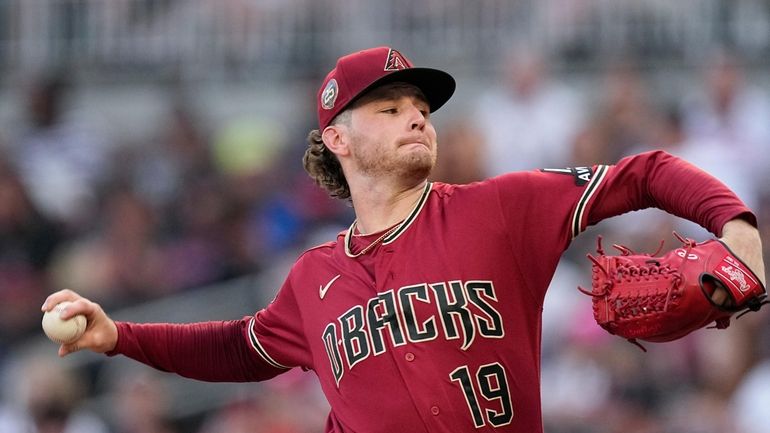 Arizona Diamondbacks starting pitcher Ryne Nelson delivers to an Atlanta...