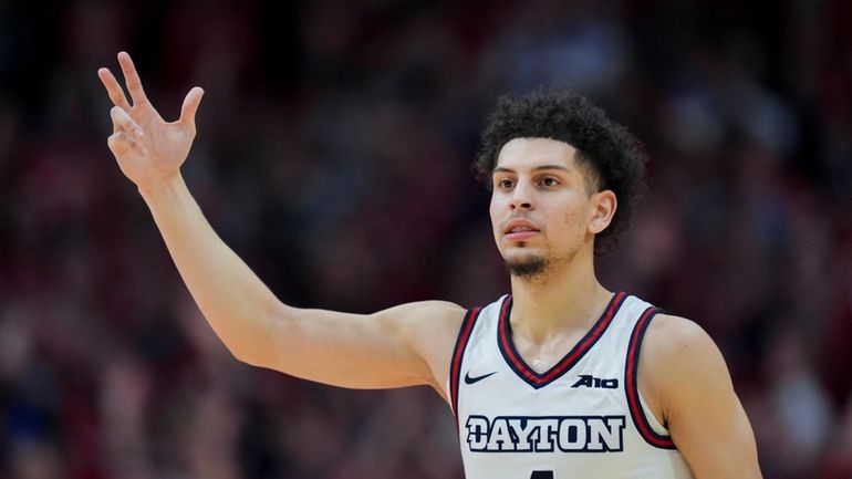 Dayton guard Koby Brea reacts to a 3-point basket during...