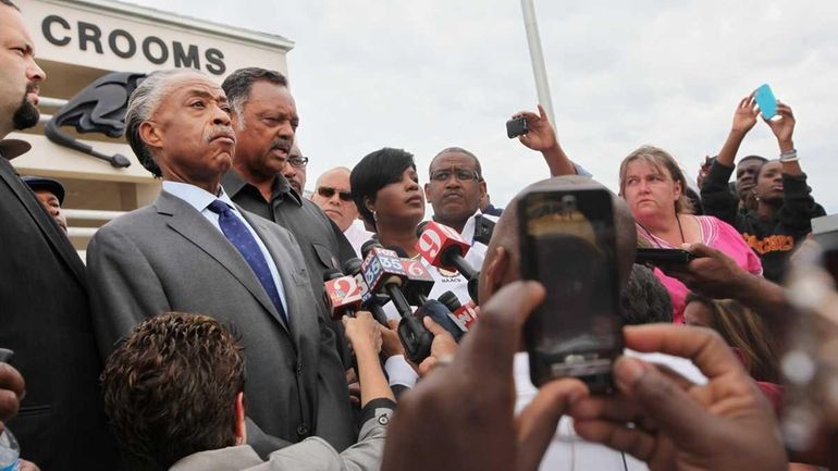 (L-R) NAACP President Benjamin Jealous, Rev. Al Sharpton and Rev....