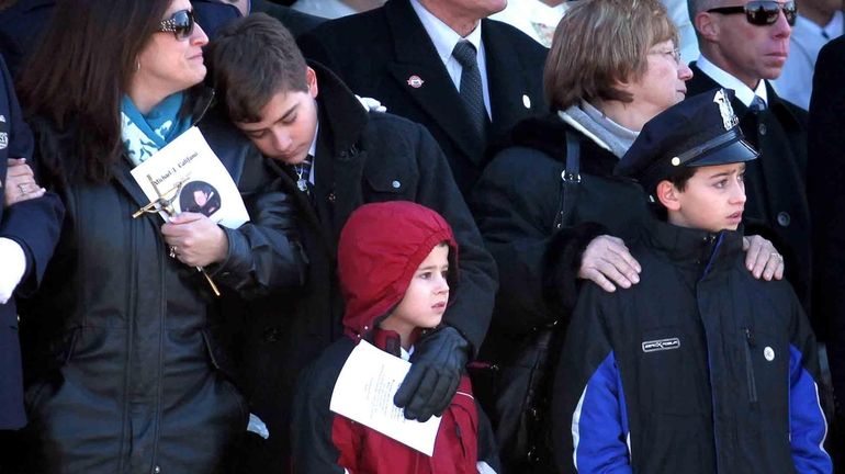 Jackie Califano, with her sons Michael, 14, Andrew, 6, and...