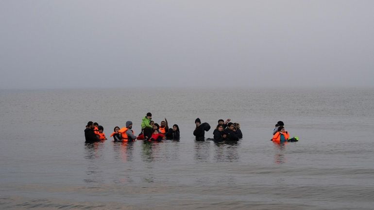 A group of Kurdish migrants from Iran and Iraq who...