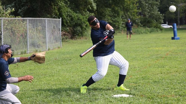 Jay Williams takes a swing during an August scrimmage in Rockville...