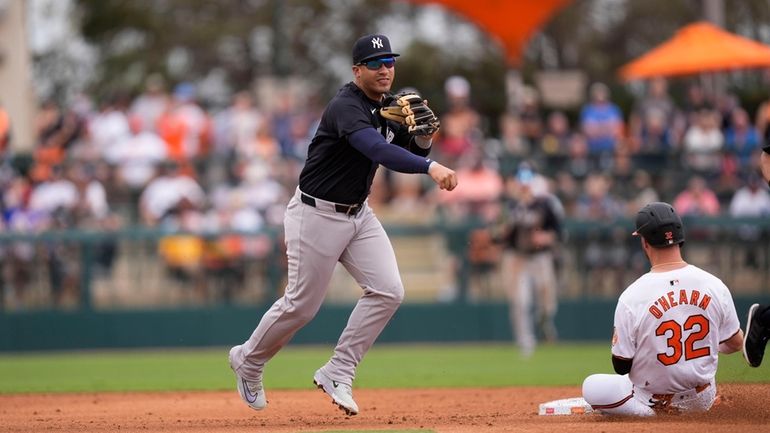 The Orioles' Ryan O'Hearn is forced out at second as...