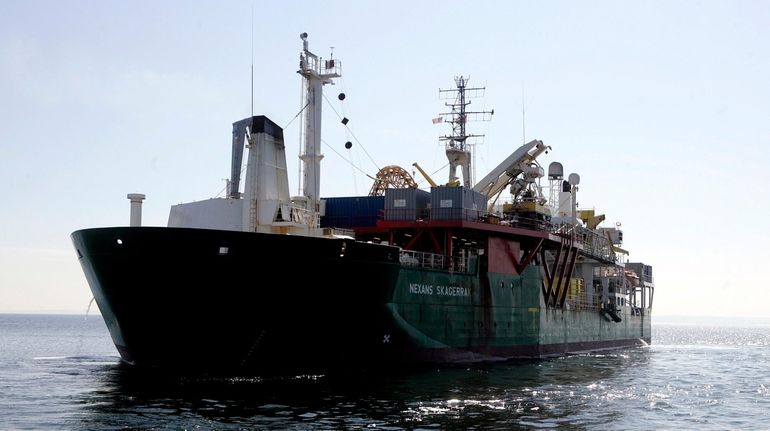 A barge finishes laying replacement electrical cable off Connecticut in 2008....