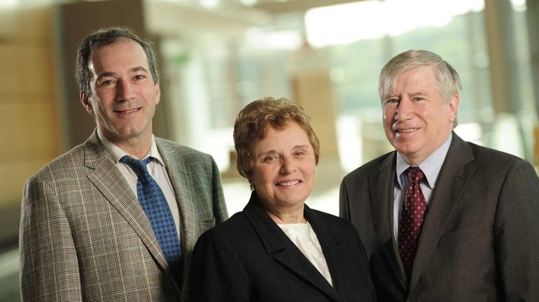 Stony Brook University researchers Alexander Dagum, left, Marie Badalamente and...