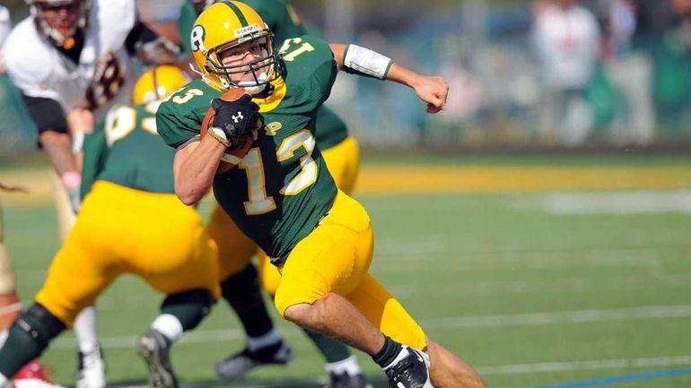 Post quaterback Steven Laurino scoots away from the defense during...