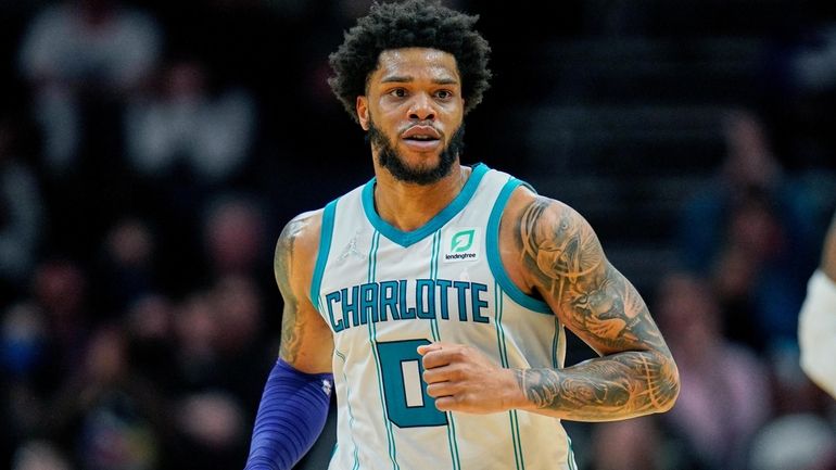 FILE - Charlotte Hornets forward Miles Bridges (0) moves up...