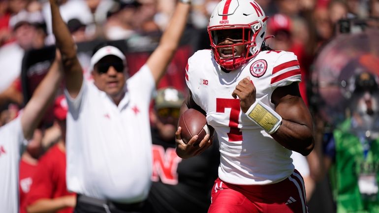 Nebraska quarterback Jeff Sims heads into the end zone for...