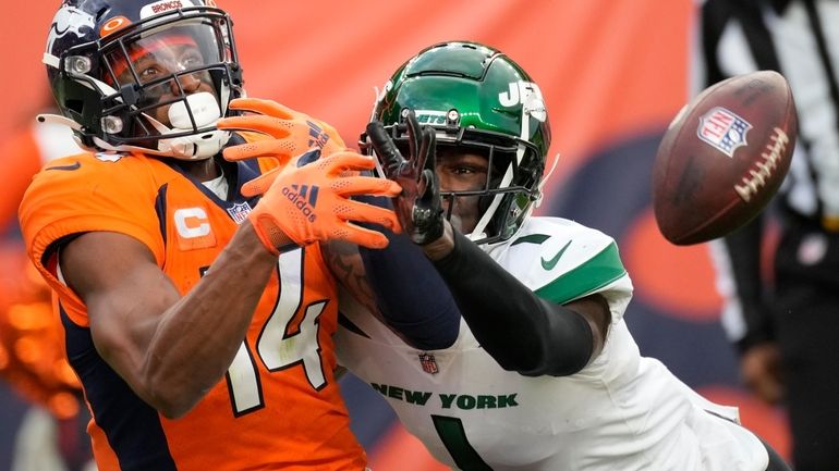 Hall hurt after 62-yard TD in Jets' win over Broncos