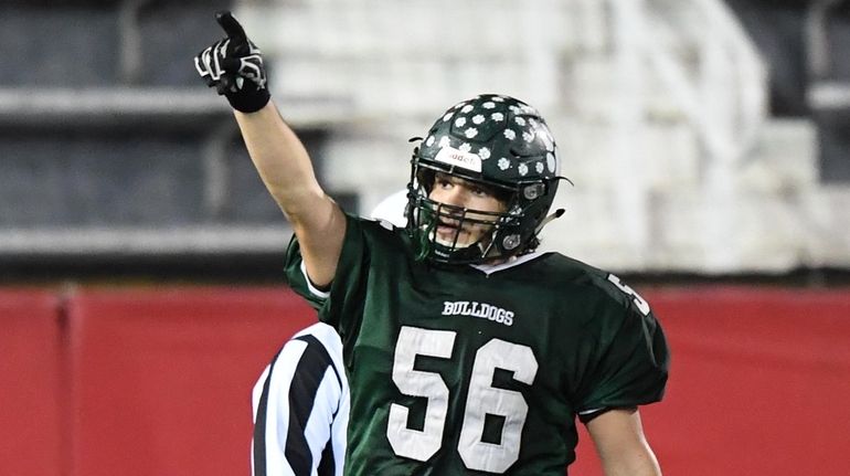 Lindenhurst's Will Ruckert reacts after he sacks William Floyd quarterback...