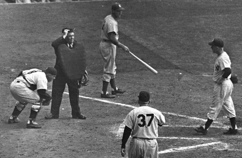 Joe Girardi, Yogi Berra and Whitey Ford watch New York Yankees Derek Jeter  receive his World Series championship ring before playing the Los Angeles  Angels of Anaheim on opening day at Yankee