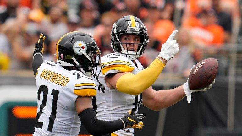 Pittsburgh Steelers linebacker T.J. Watt (90) celebrates after an interception...