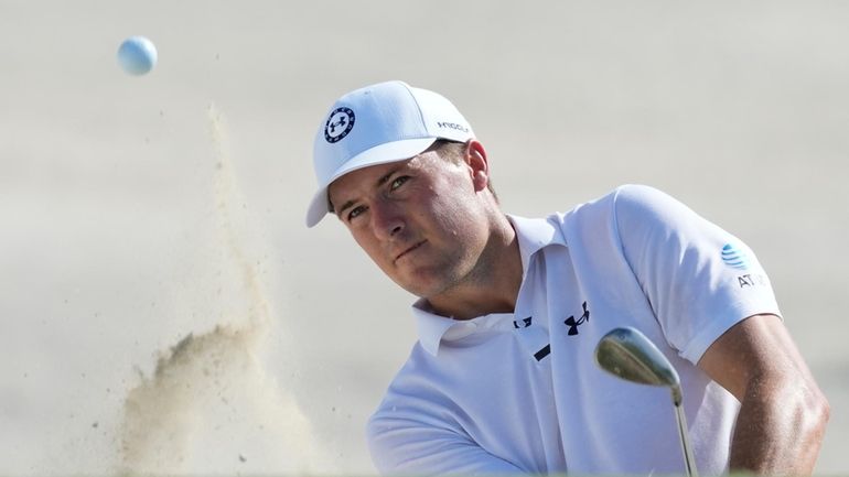 Jordan Spieth, of the United States, watches his hit from...