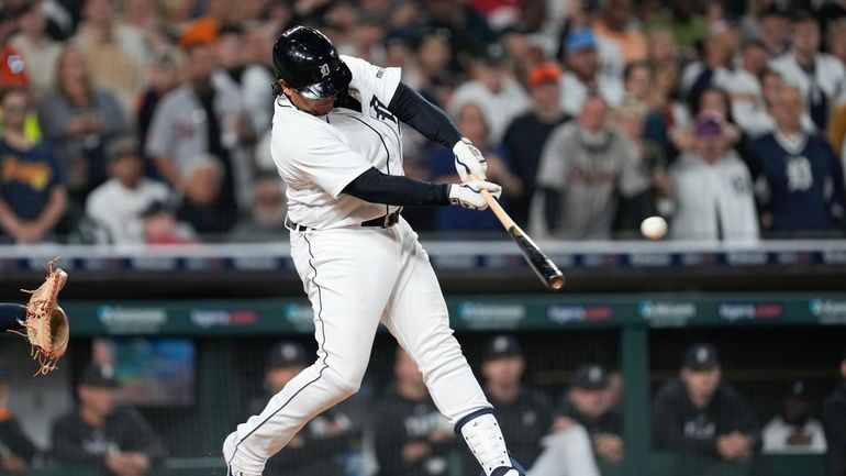 Detroit Tigers' Miguel Cabrera hits a single against the Cleveland...