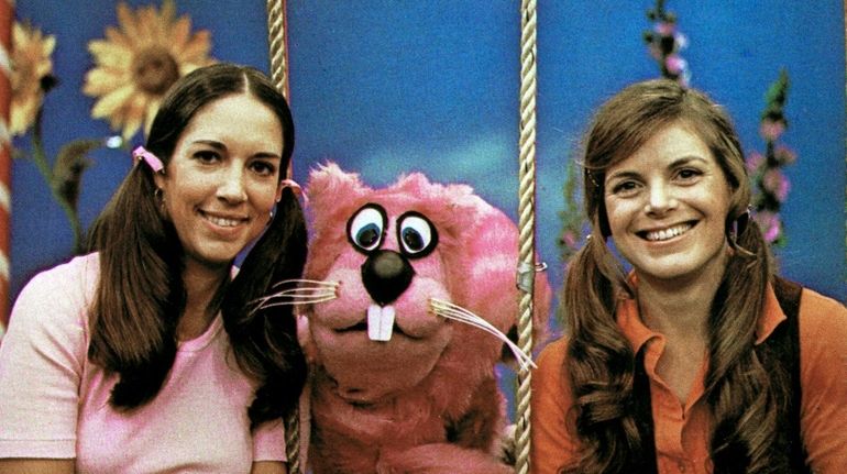 Paula Janis, left, and Carole Demas with Sherlock the Squirrel...