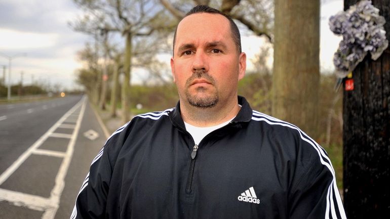 Michael Hickey, a truck driver from Patchogue, stands at the...