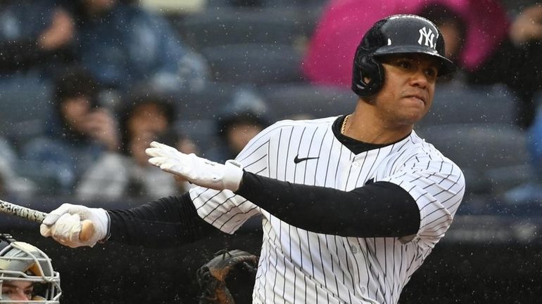 Juan Soto, Yankees rightfielder, connects for a three-run double to...