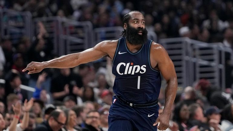 Los Angeles Clippers guard James Harden gestures during the first...