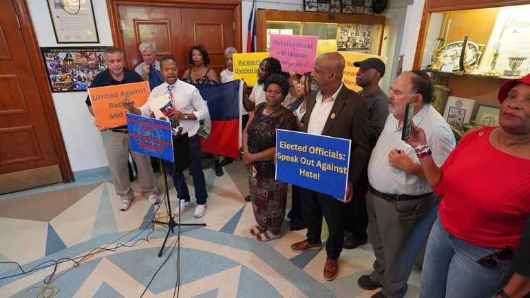 Members of the Haitian community on Long Island gather on...